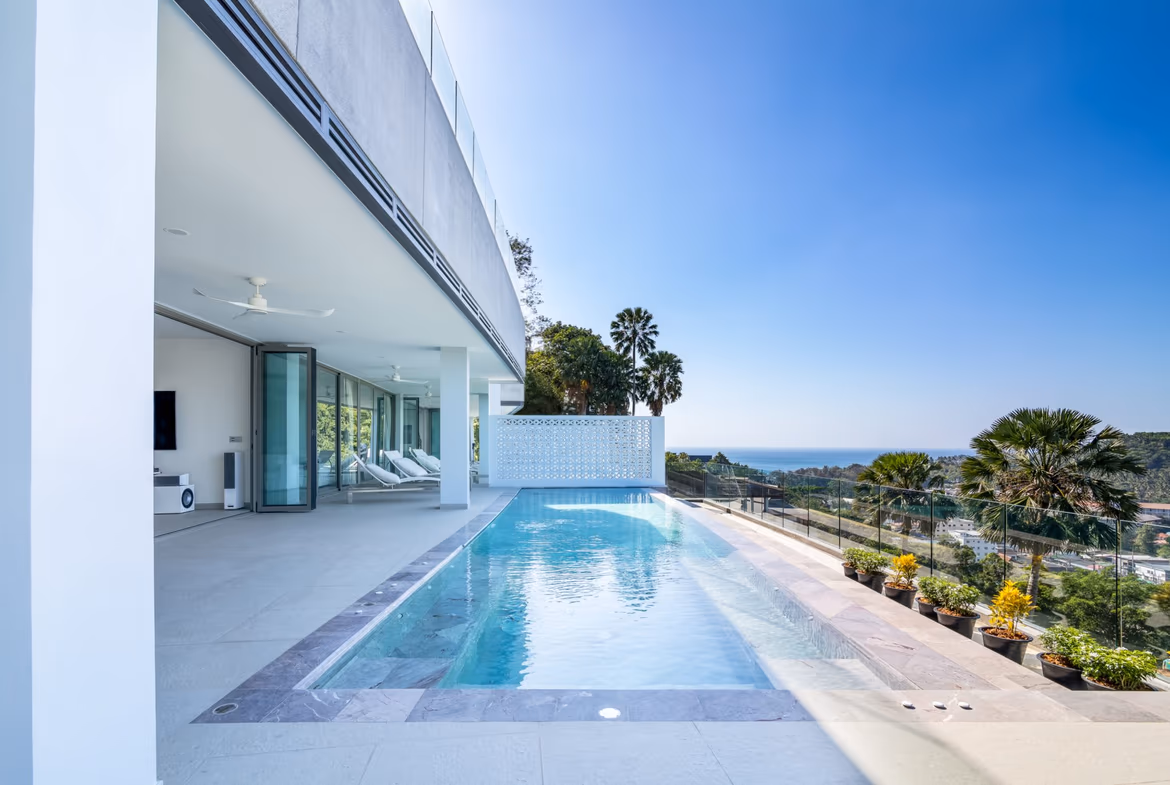 Bright terrace pool of a modern Surin Beach condominium with sea view