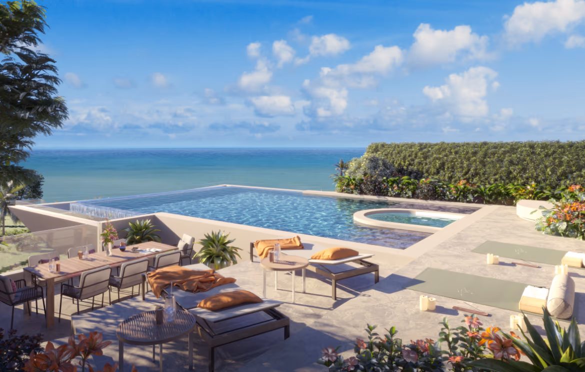 This photo shows a spacious, modern living area with large windows offering a sea view.