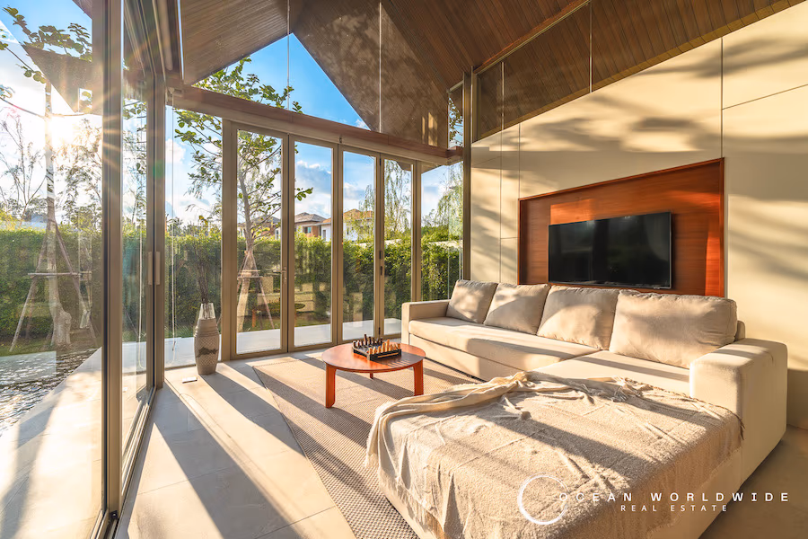 This is a residential property with a pool, living room, kitchen, and bathroom.