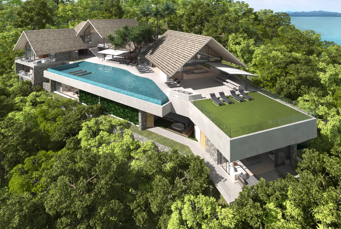 This elevated villa sits on a peninsula overlooking the water in Cape Yamu. Its modern design features large windows and balconies to maximize the ocean views.