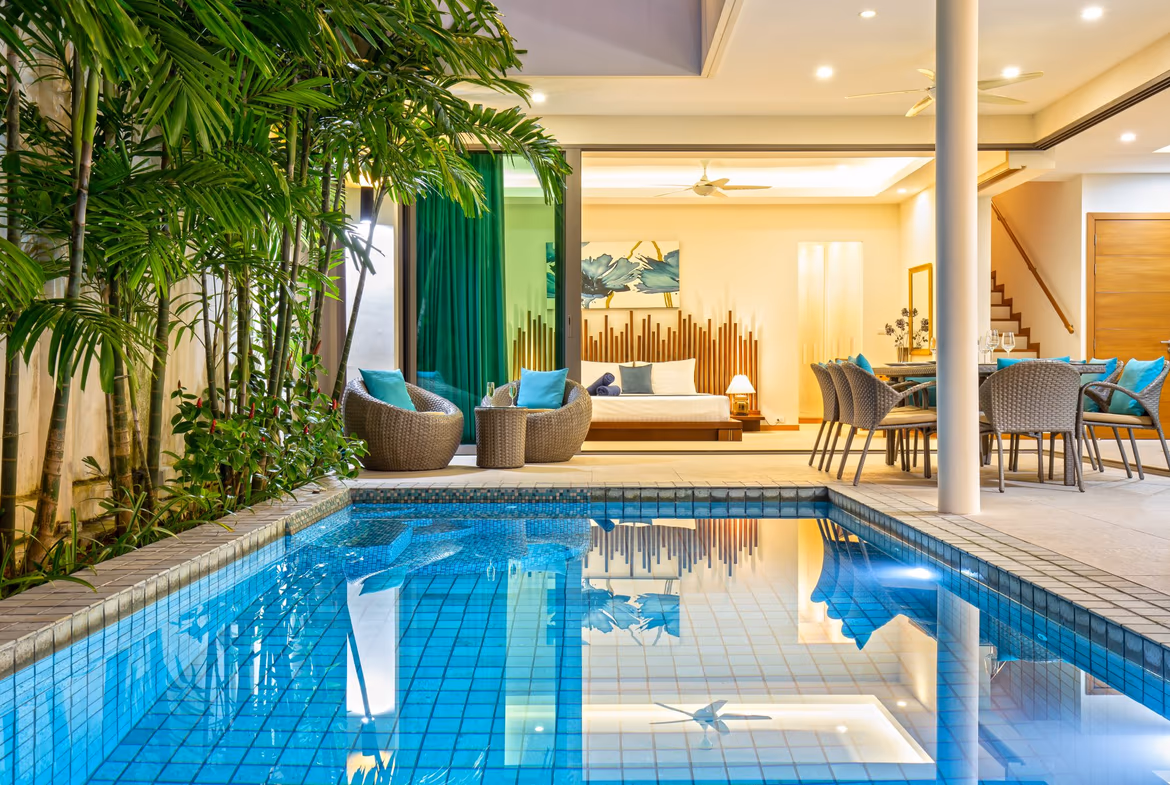 Hero shot of a three-bedroom modern villa in Rawai, featuring a large, inviting swimming pool.