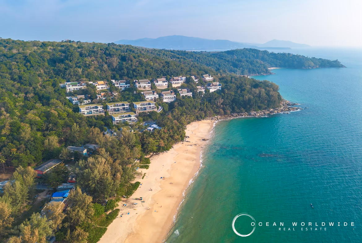 Exterior view of a four-bedroom apartment building in Layan, featuring a clear seaview. The property is designed with a modern architectural style.