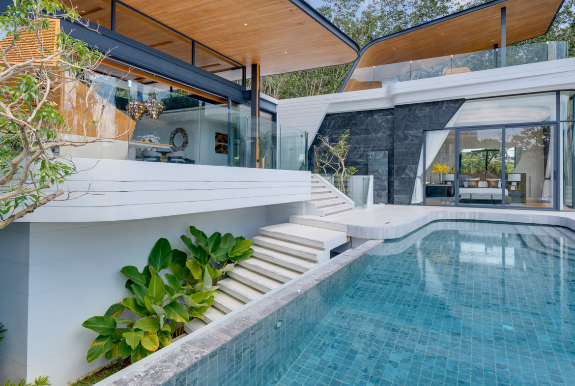 This photo likely shows the property's infinity pool overlooking a tropical bay with distant islands.