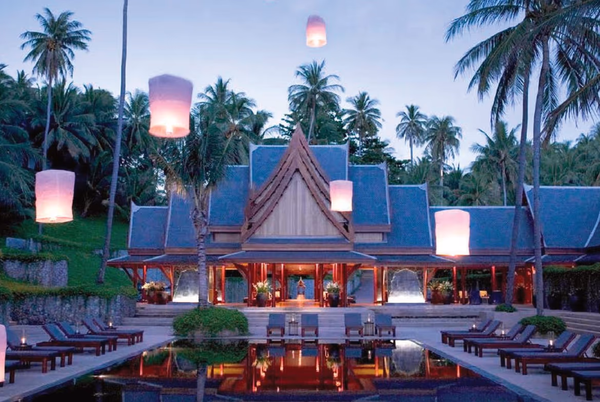 A white four-bedroom villa with a red tile roof in Bang Tao.