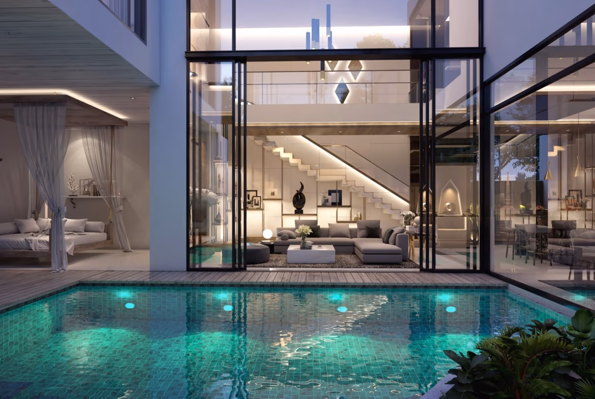 A modern two-story villa with a private pool in Surin. The white building features a flat roof and large windows, surrounded by tropical greenery.