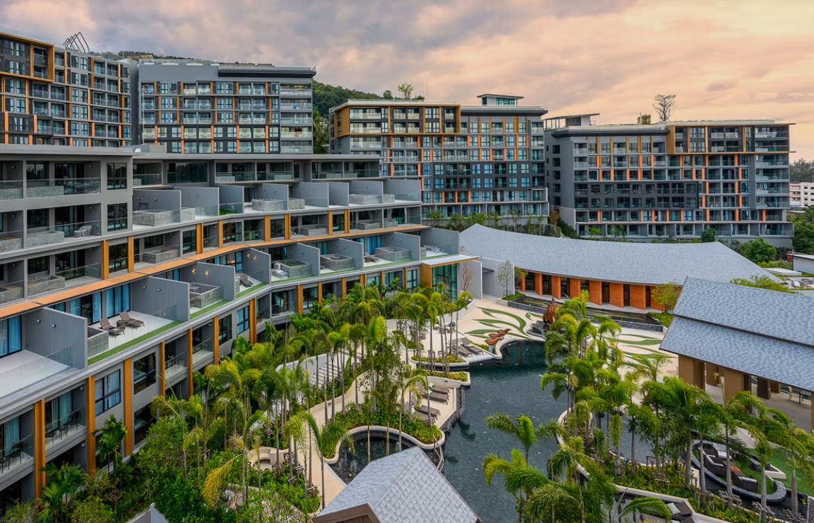 One-bedroom condominium in Bang Tao with a sea view. The condo features a balcony overlooking the water.