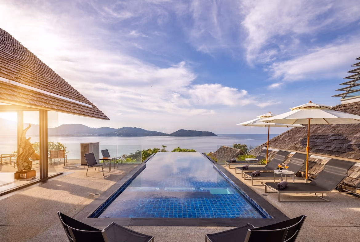 A luxurious bathroom with a large bathtub and ocean views.