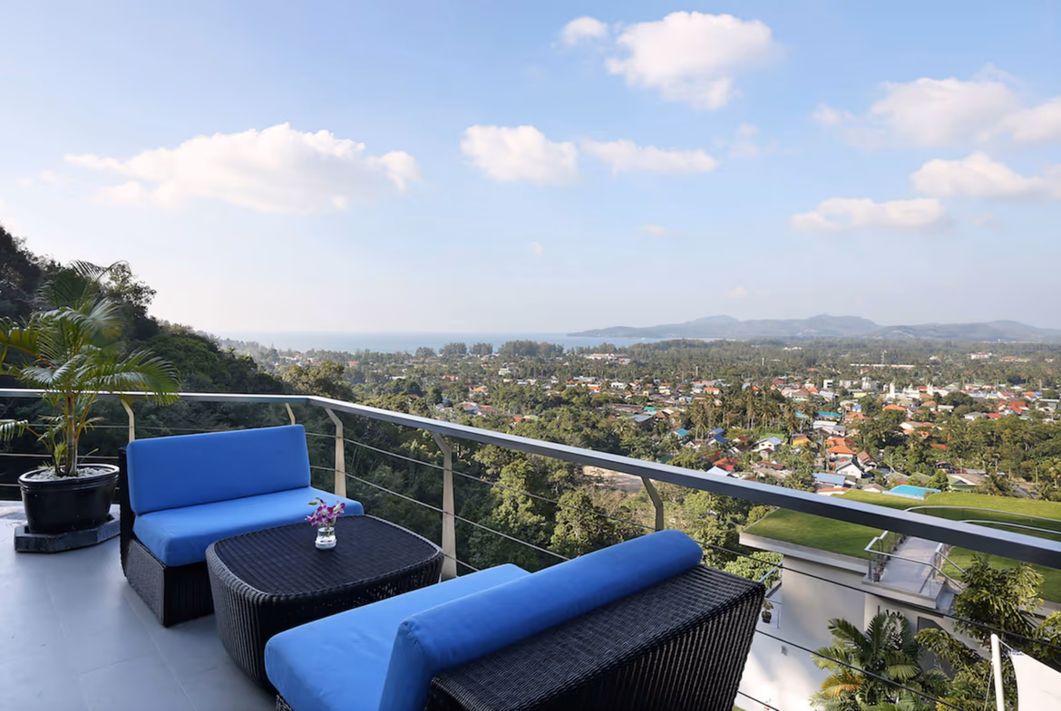 The photo likely shows an ocean view from a modern villa, possibly from a balcony or large window.