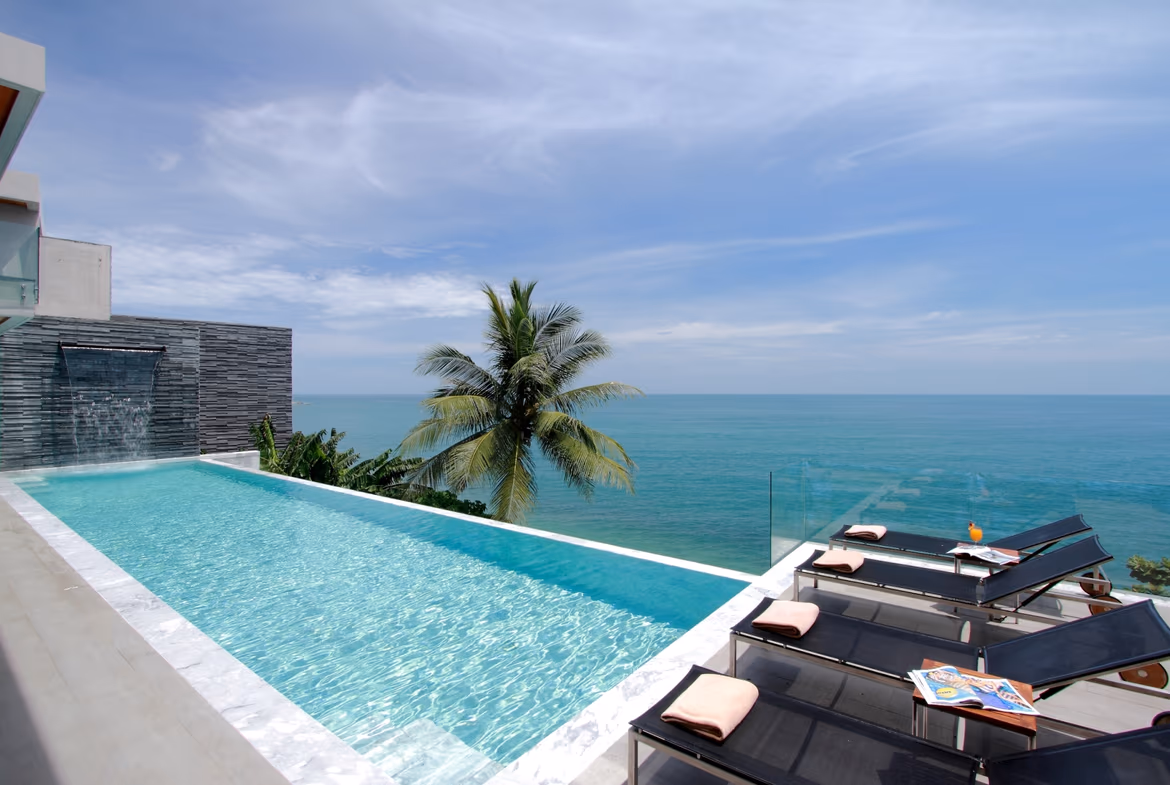 Contemporary six-bedroom villa in Kamala, featuring multiple balconies and direct beach access.
