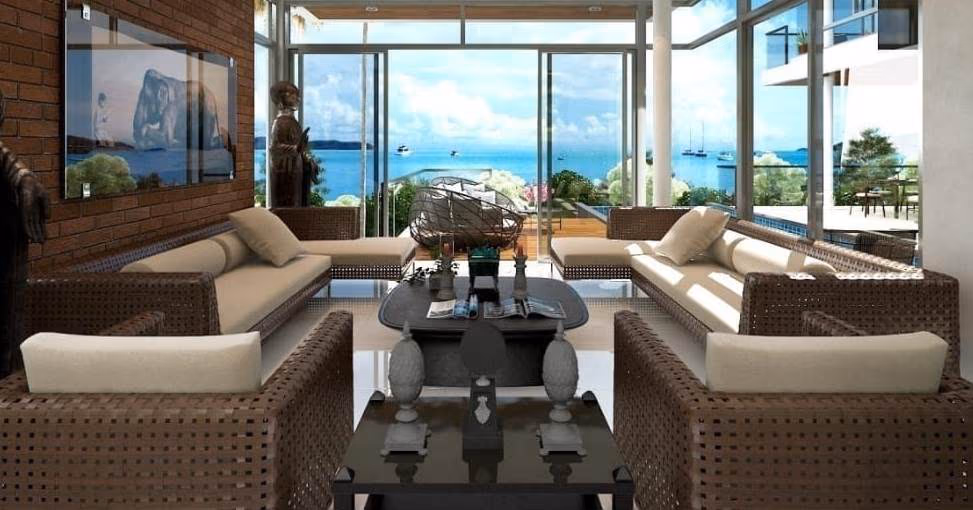 A spacious, sparsely furnished living room with a long sofa, coffee table, and a large window looking out onto a pool.