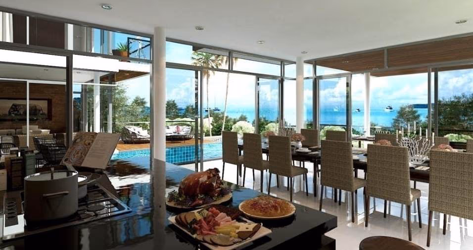 A modern open-plan living area with a sofa, TV, and dining table.