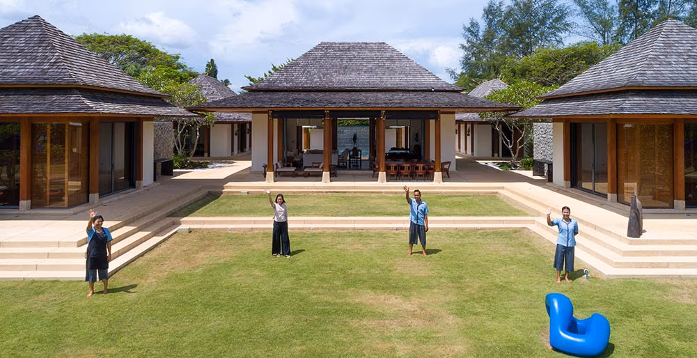 A spacious living room with large windows overlooking the ocean.