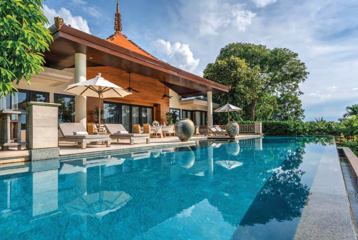 A luxury three-bedroom villa in Layan with a sea view. The villa has a multi-story, modern design.