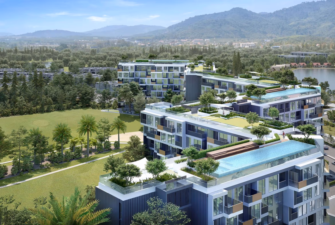 A modern, low-rise 1-bedroom condominium building with large balconies in Bang Tao. The building features an angular, contemporary architectural style.