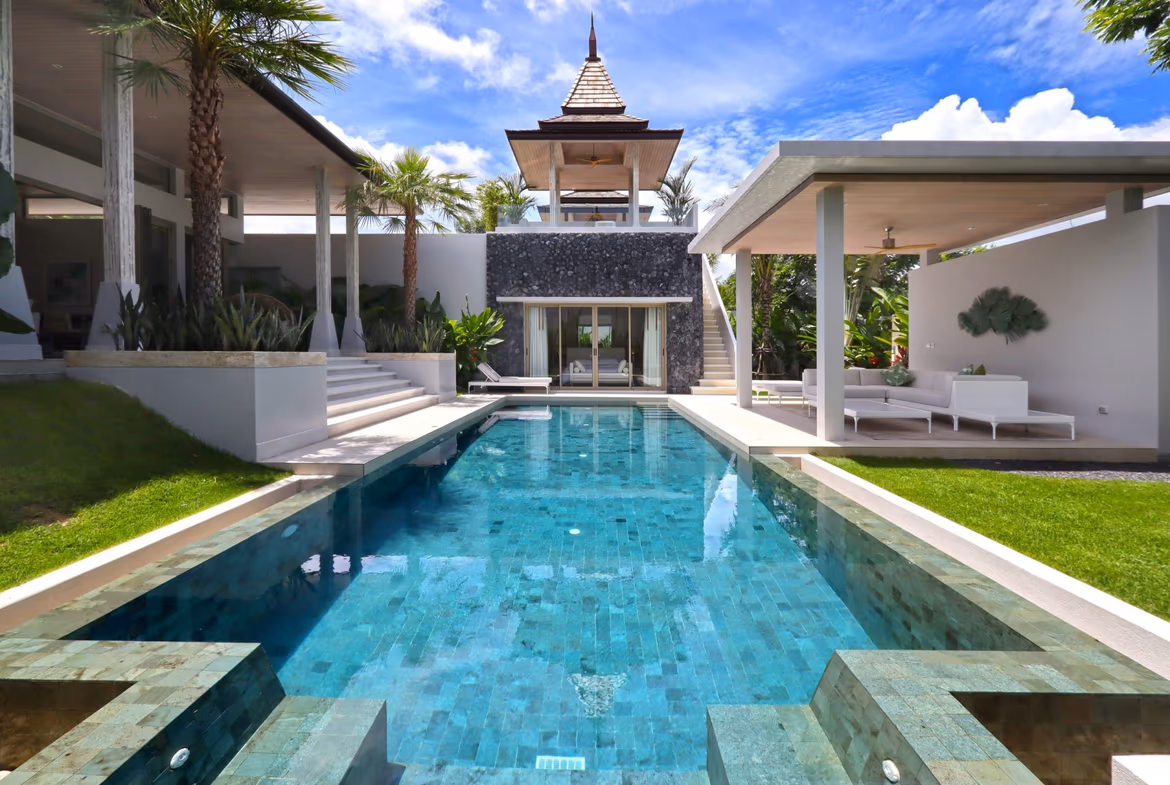 An exterior view of a Balinese-style villa in Bang Tao with a private pool.