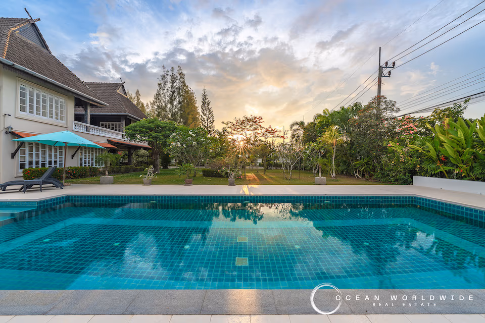 This photo likely shows the property's exterior, featuring a traditional home on a large plot.