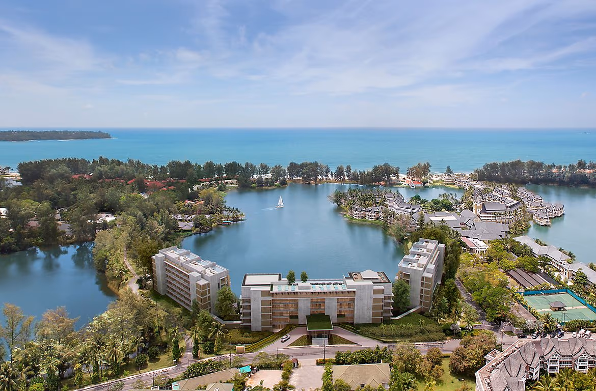 Exterior of a luxury ocean-view condominium in Laguna, featuring two bedrooms and a spacious balcony overlooking the water.