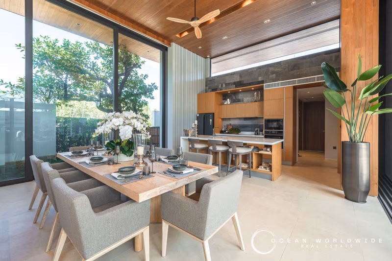 A spacious living area with comfortable seating and a large flat-screen TV.