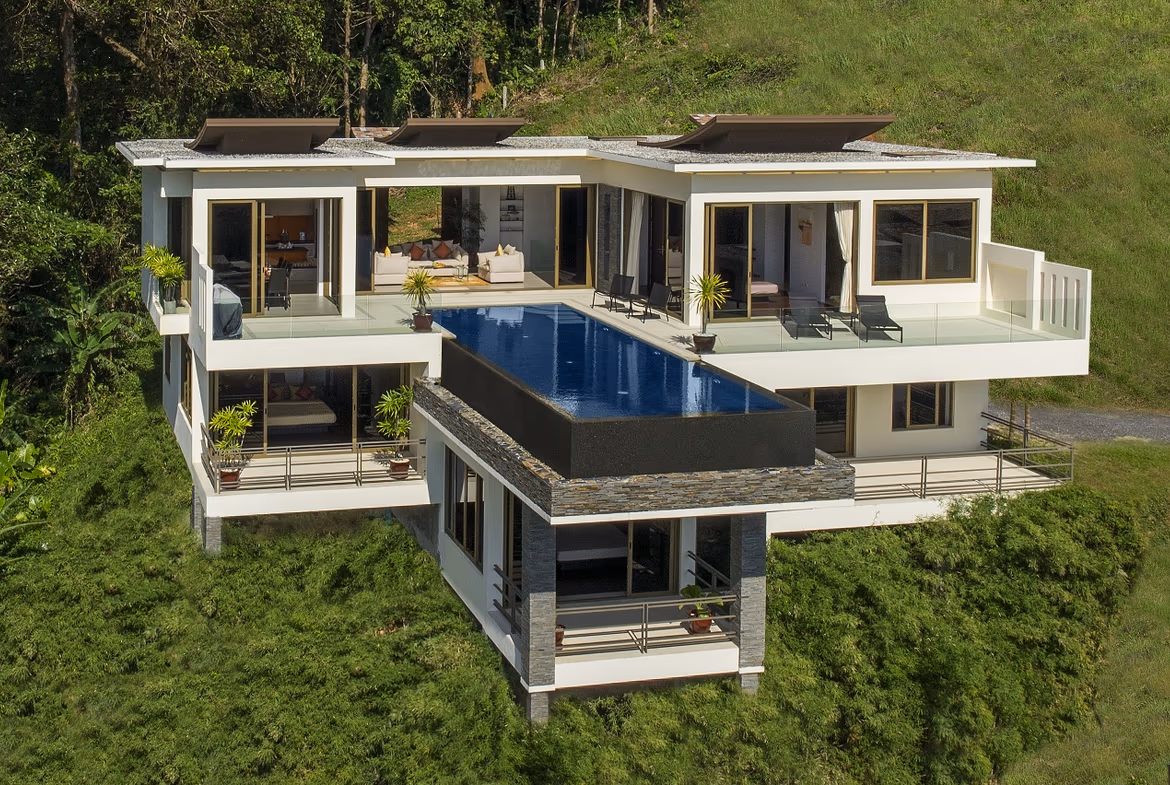Exterior view of a multi-story villa in Naithon with a private infinity pool overlooking the ocean.