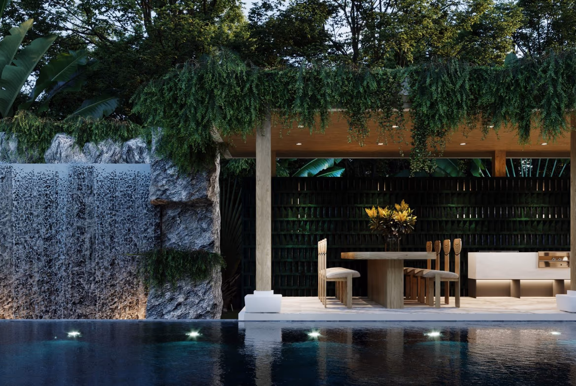 An outdoor seating area with a sofa and chairs next to a private swimming pool.