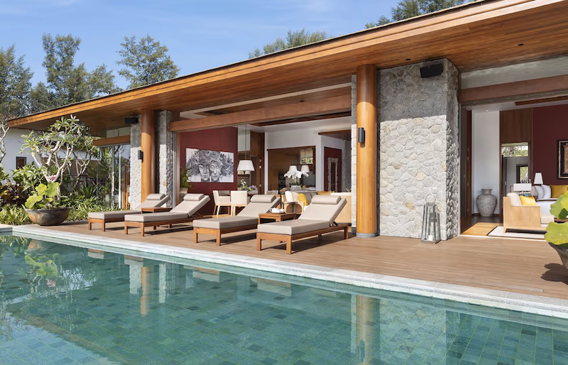 A modern kitchen with a large island and ample seating.
