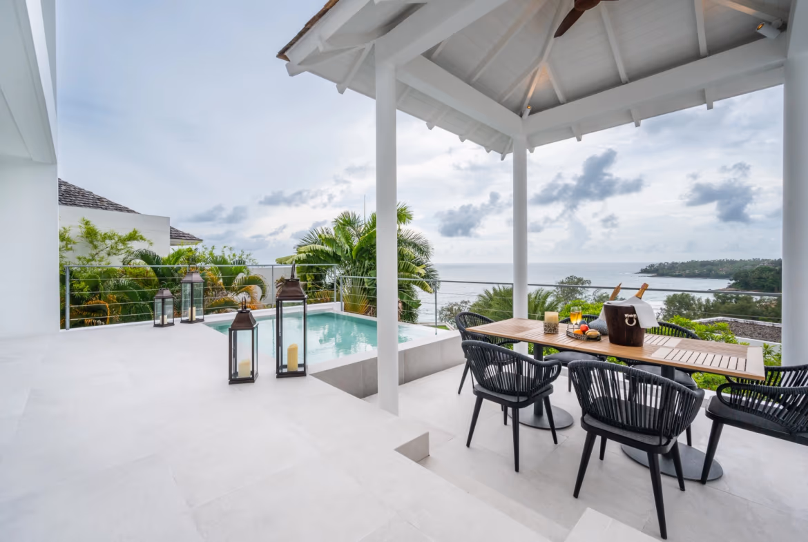 A three-bedroom condominium in Cherngtalay, Thailand, featuring a private pool and an ocean view over Surin Beach.
