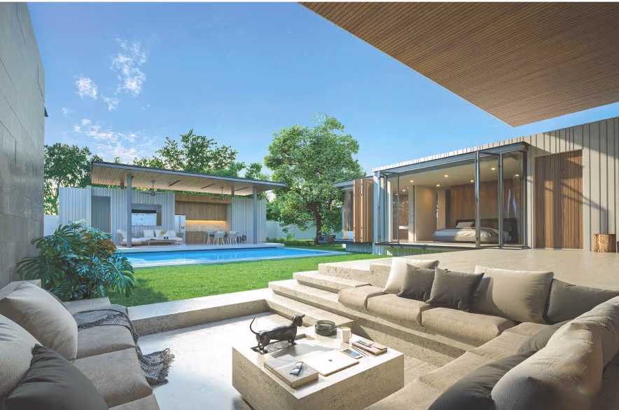 A spacious outdoor patio with a swimming pool and sun loungers.