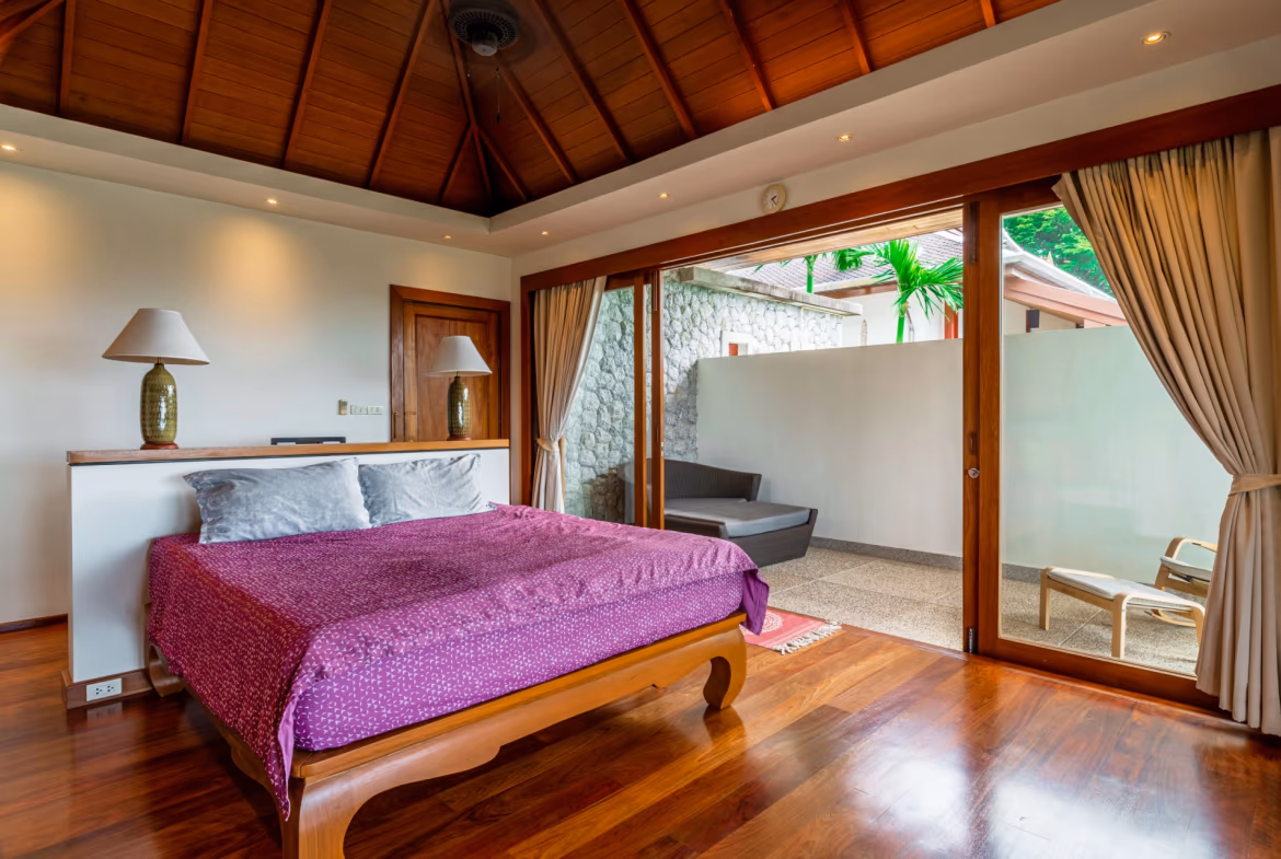 This photo shows a spacious, well-lit living area with modern furnishings and expansive ocean views.