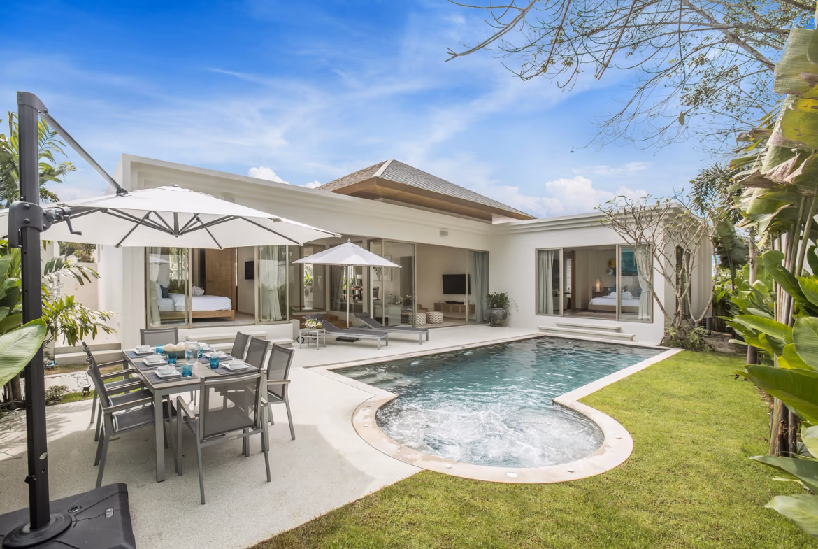 Three-bedroom villa in Pasak with a private pool. The modern white building has a flat roof and large glass doors facing the pool.