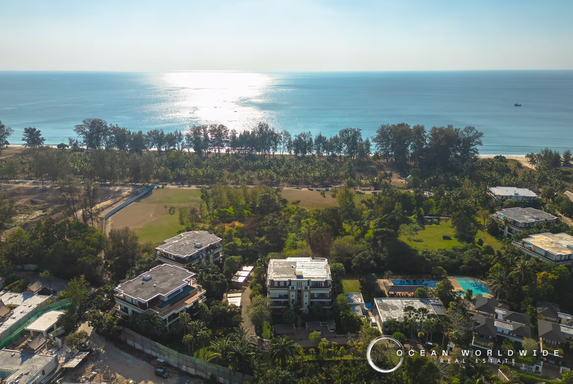 An ocean view from a spacious balcony overlooking Bang Tao Beach and the surrounding area.