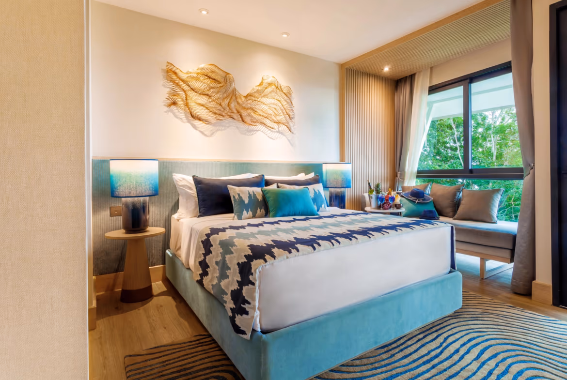 A spacious and elegantly furnished living area with large windows overlooking a scenic outdoor landscape.