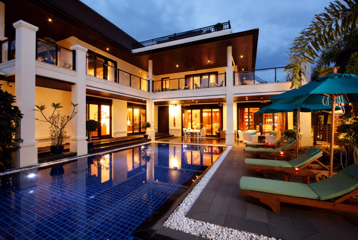 A spacious living area with floor-to-ceiling windows overlooking the ocean.