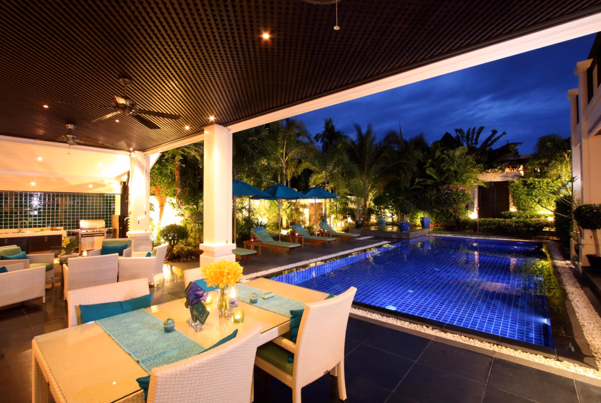 A spacious living room with large windows overlooking the ocean.