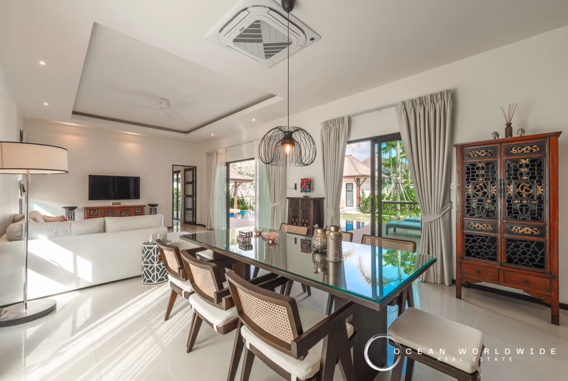 The photo probably shows a bedroom or living area with a view of the private pool.