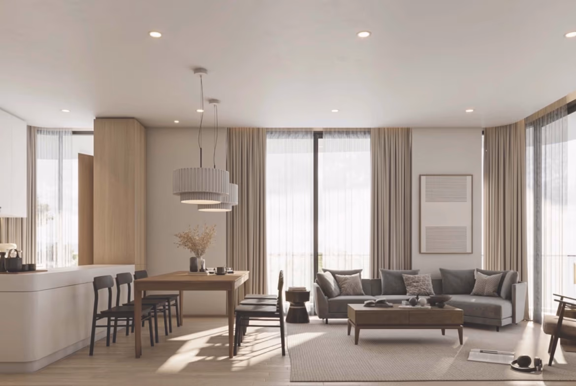 A modern living room with a large window overlooking a lush, tropical landscape.