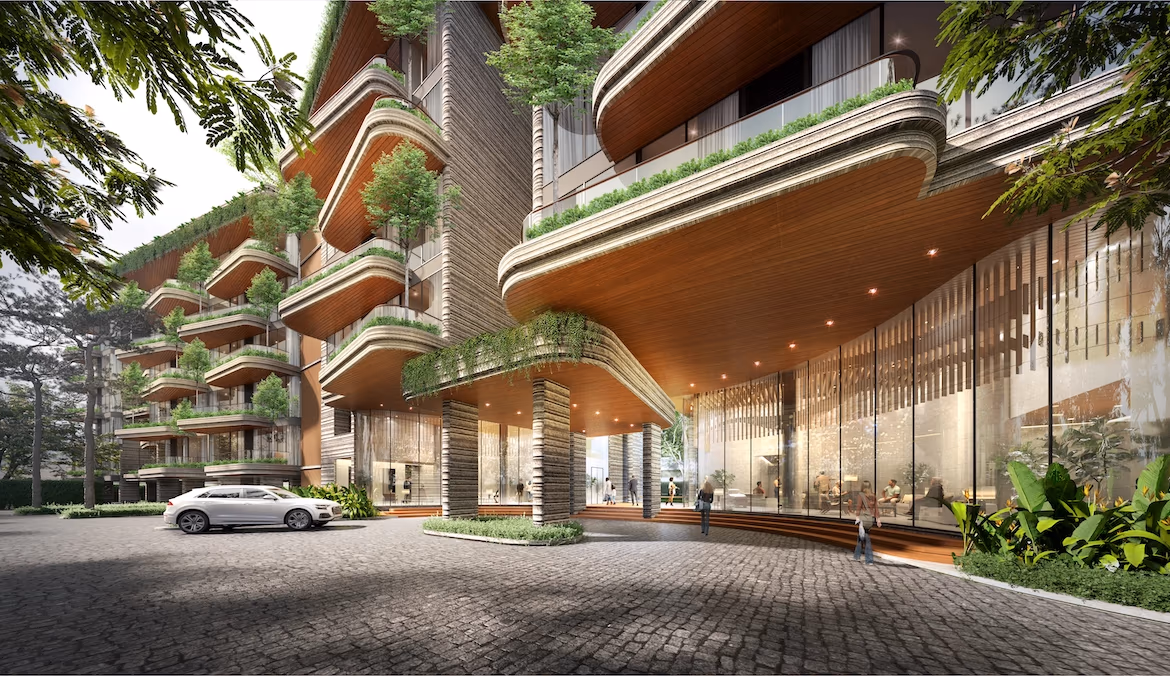 Modern apartment building with a white exterior and large windows, surrounded by tropical landscaping. Located in Cherngtalay, this property is near an international school.