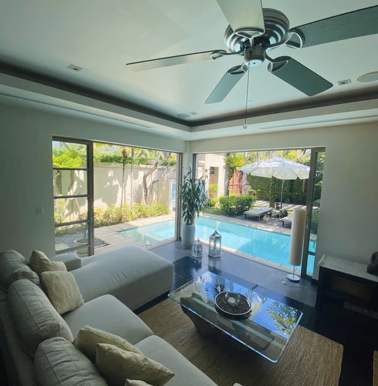 A spacious bedroom with a large bed and patio access.