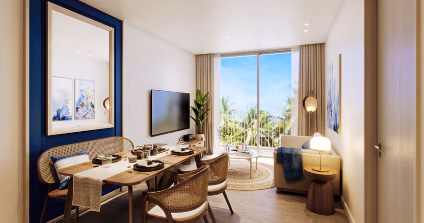 A spacious, modern living room with large windows overlooking a beach.