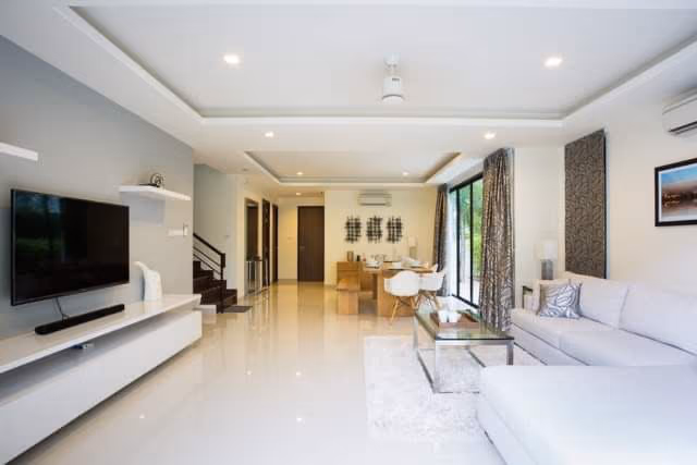 A modern kitchen with stainless steel appliances and an island.