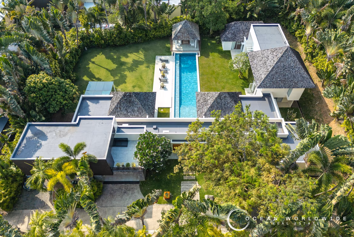 A private swimming pool with an outdoor lounge area.
