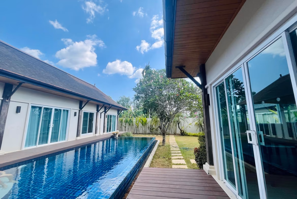 A four-bedroom villa in Layan featuring a private pool visible from the exterior.