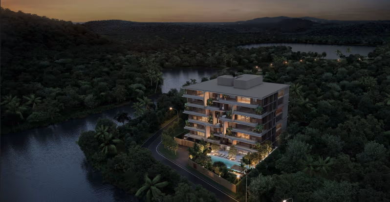 The photo shows an exterior view of the condominium building with a pool and palm trees.