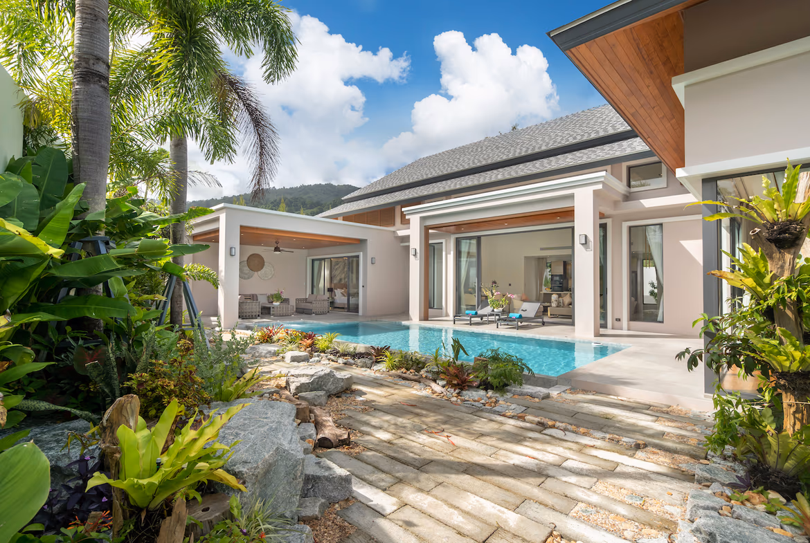 An outdoor swimming pool with an adjacent patio area.
