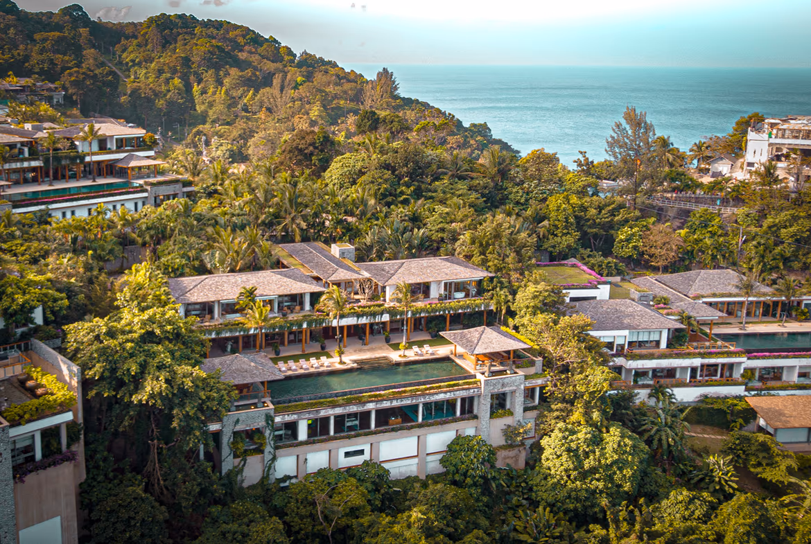 A seven-bedroom villa in Phuket featuring a private pool. The spacious exterior overlooks the ocean.