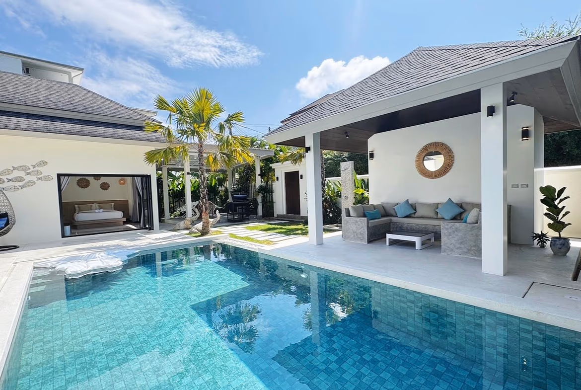 Exterior view of a 4-bedroom villa in Phuket. A private pool is visible in front of the house.