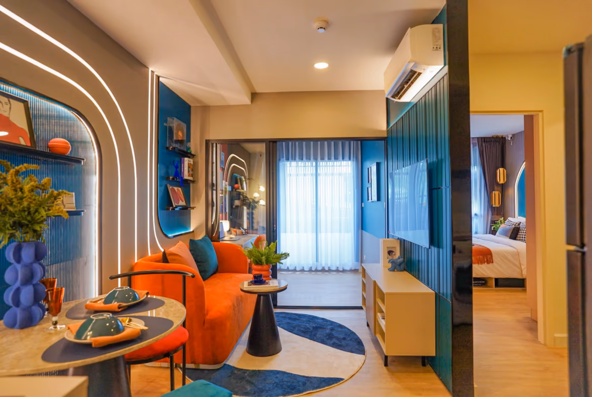 Exterior view of a modern 1-bedroom condominium in Thalang, featuring a prominent balcony.