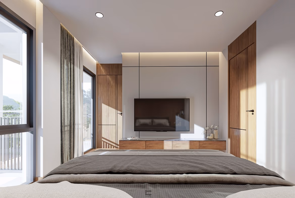 A spacious living room with modern furnishings and large windows.