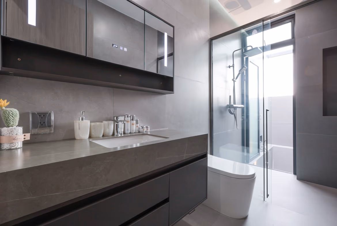 A modern bathroom with dual sinks, a large mirror, and decorative wall art.