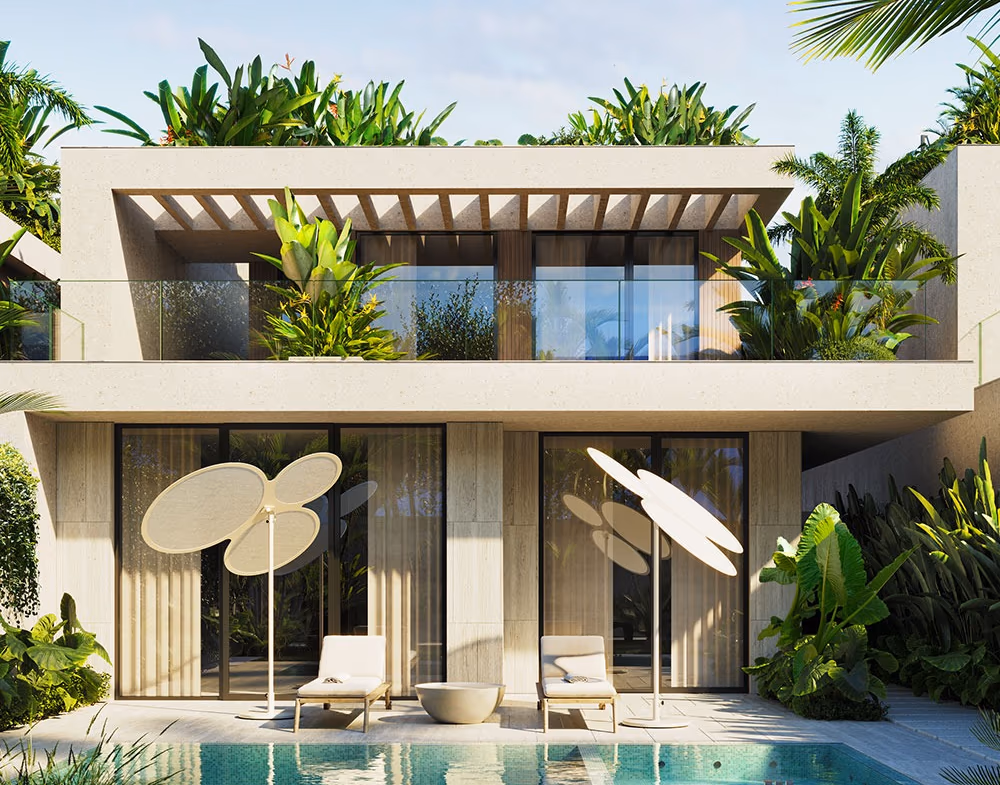 An open-concept living area with a sofa, coffee table, and television, opening onto an outdoor patio.