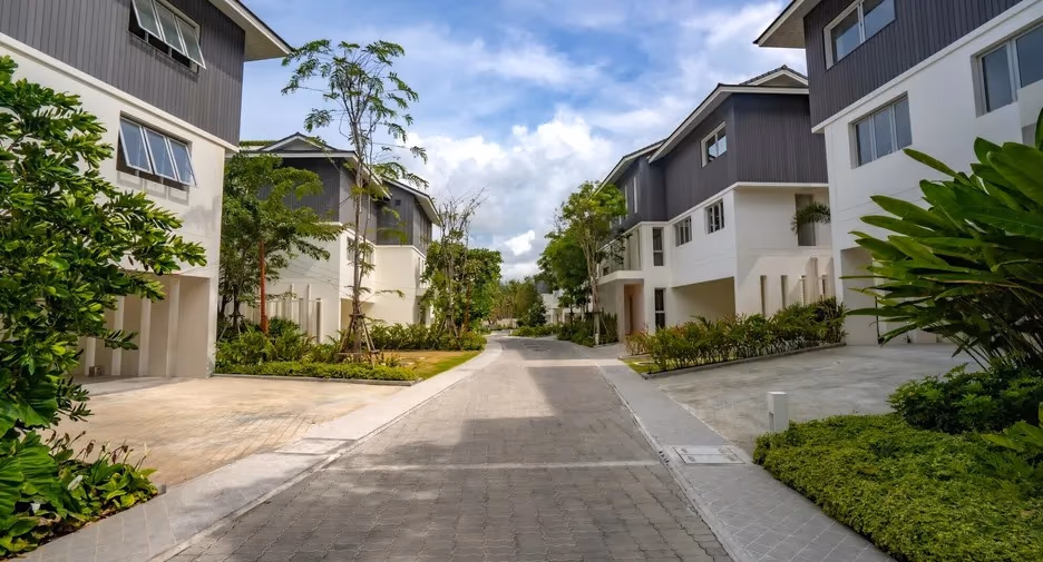 Exterior of a 2-bedroom condominium in Phuket, featuring a private pool and beachfront access.